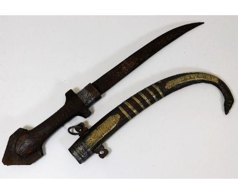 An early 20thC. Turkish Islamic dagger with decorative scabbard