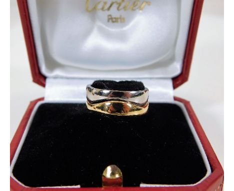 An 18ct gold two piece white &amp; yellow gold Cartier waves ring with box 7.2g size J/K