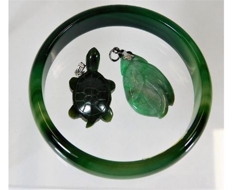 A jade carved pendant twinned with similar hardstone tortoise &amp; bangle