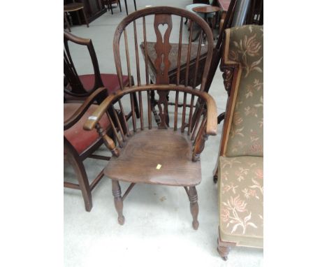 A 19th Century beech and elm hoop and stick back Windsor armchair having solid seat and crinoline stretcher, width approx. 54