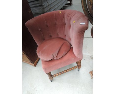 A late 19th mahogany corner chair having later pink upholstery on bobbin frame