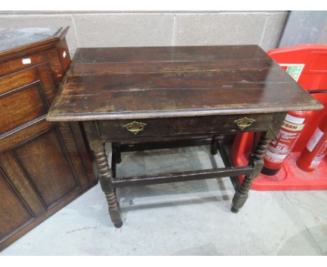 An 18th and later oak side table having rectangular top with frieze drawer and bobbin supports, width approx.90cm