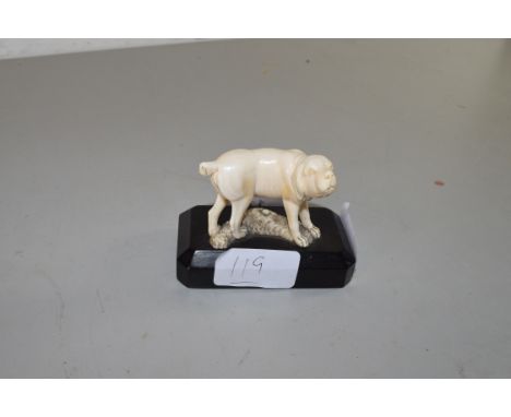 SMALL ANTIQUE IVORY MODEL OF A DOG SET ON WOODEN PLINTH BASE