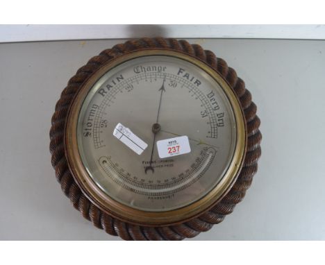 EARLY 20TH CENTURY ANEROID BAROMETER AND THERMOMETER COMBINATION, THE DIAL MARKED 'FISONS (IPSWICH) FERTILISER PRIZE' SET IN 