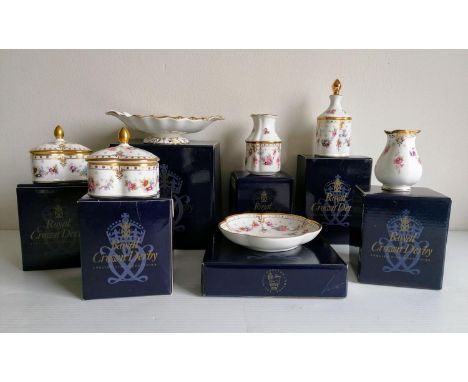 A selection of Royal Crown Derby Royal Antoinette comprising: two  trinket boxes, duchess tray sweet, perfume bottle, primros