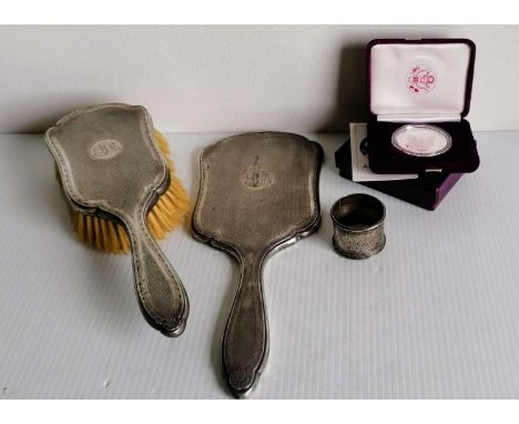 A George V silver brush and hand mirror with engine turned design, cartouche filled, by Daniel Manufacturing Company, Birming