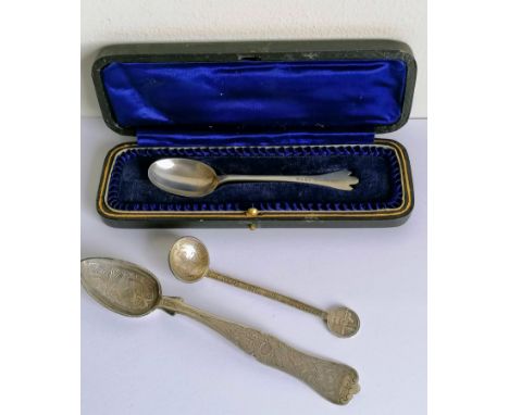 A Kruger Boer War trench art silver spoon, 11cm; an Islamic etched silver spoon, 16 cm; a cased George V chrintianing spoon w