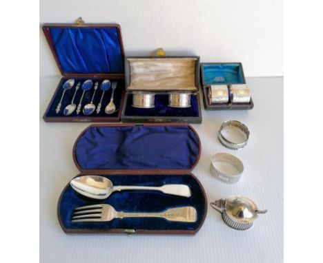 Two Victorian cased pairs of silver napkin rings, two other later loose, marks rubbed; cased fork and spoon by Robert Wallis,