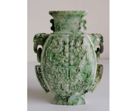 A Chinese two-handled green jade vase on a raised base, 13 cm H 