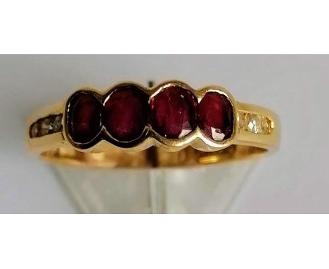 A ruby and diamond ring on a yellow gold setting, size M, testing for 18ct gold, 2.45g 