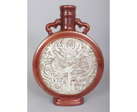 AN UNUSUAL CHINESE WANG BINRONG STYLE PORCELAIN MOON FLASK, each side decorated with a moulded white glazed dragon panel rese