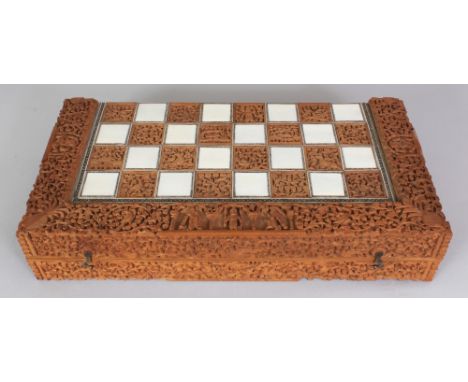 A GOOD QUALITY 19TH/20TH CENTURY INDIAN IVORY & SANDALWOOD FOLDING CHESS & BACKGAMMON BOARD, the exterior with squares in ivo