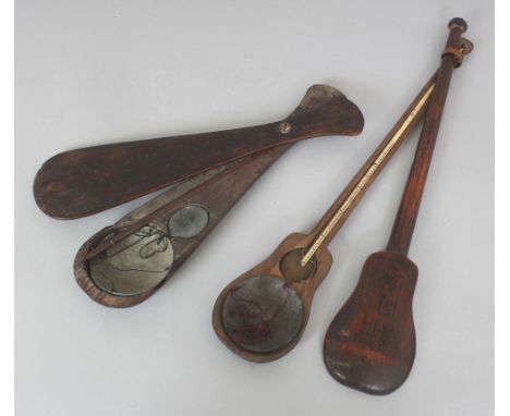 TWO EARLY 20TH CENTURY CHINESE OPIUM SCALES, in paddle-form and violin-form wood cases, the cases 11.25in & 15in long. (2)