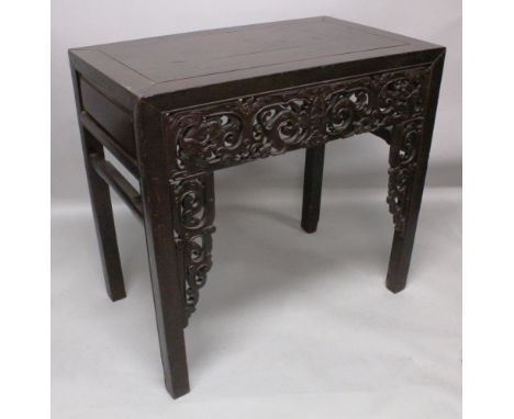 A GOOD 19TH CENTURY CHINESE RECTANGULAR HARDWOOD ALTER TABLE, the pierced frieze carved with scroll work and buddhistic lion 