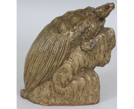 A 19TH/20TH CENTURY JAPANESE CELADON MODEL OF A MINOGAME TURTLE, clinging to a rocky outcrop, 5.9in high.