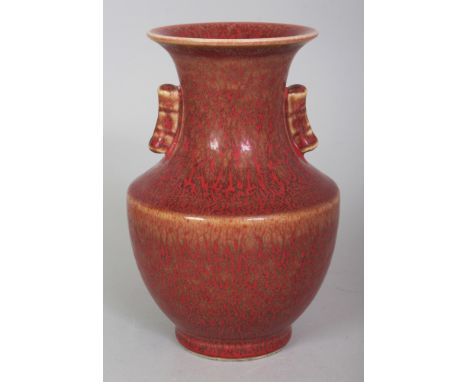 AN UNUSUAL CHINESE IRON RUST STYLE PORCELAIN ARROW VASE, the sides applied with a flame-form red glaze over a darker ground, 