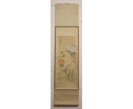 A CHINESE HANGING SCROLL PAINTING ON SILK, decorated with butterflies hovering above foliage and with calligraphy and an arti