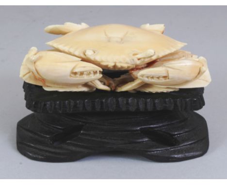 AN ORIENTAL IVORY MODEL OF A CRAB, together with a fitted wood stand, 2.8in high overall, the ivory itself 4.1in wide & 1.5in