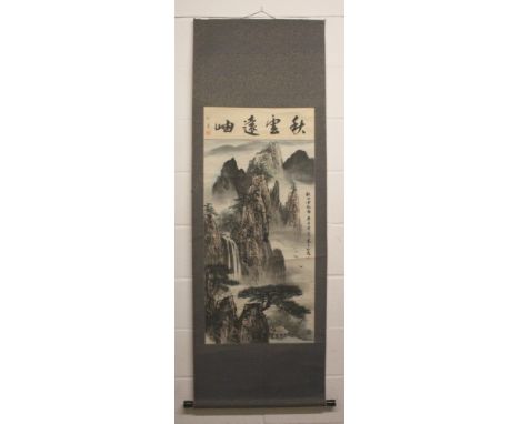 A CHINESE HANGING SCROLL PAINTING ON PAPER BY XIAN KE, painted with a panel of calligraphy above a mountainous landscape, the