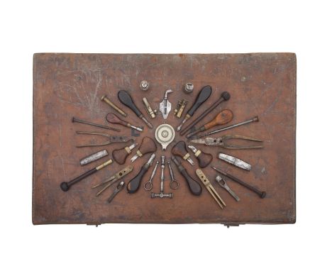 A Group Of Accessories Mostly Relating To Antique FirearmsMostly 19th CenturyComprising a circular white-metal percussion cap