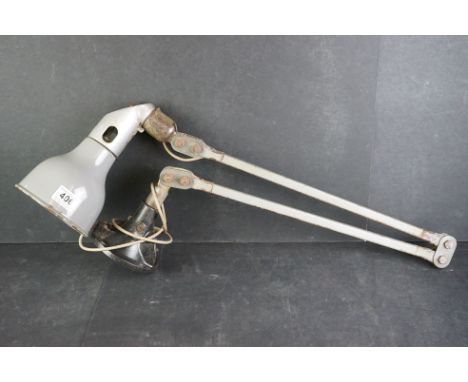 A mid 20th century industrial angle poise lamp with iron base. 