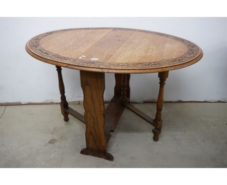 Arts and Crafts Oak Sutherland / Gate-leg Oval Table with carved border, 120cms x 90cms x 75cms high 