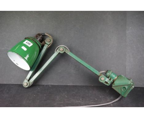 An industrial green enamel angle poise engineers lamp. 