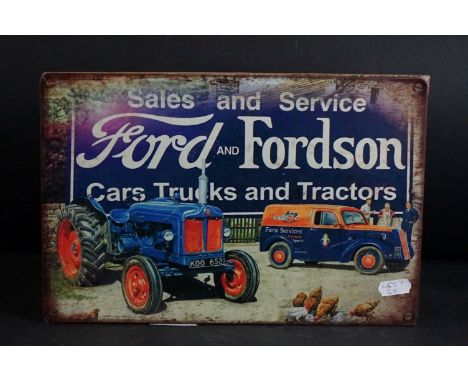 Metal tractor sign ' Ford and Fordson ' mounted on a wooden panel 
