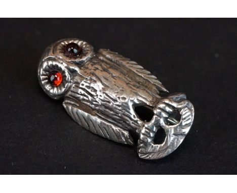 Silver brooch in the form of an owl with ruby eyes 