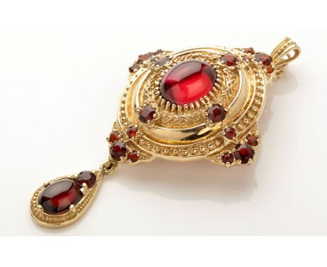 A 9ct. yellow gold holbinesque ruby and garnet set brooch/pendant, the central ruby cabochon surrounded by foliate and beadwo