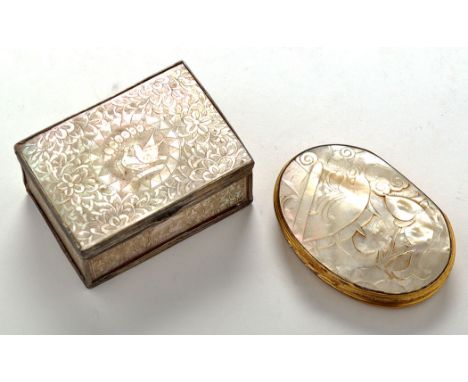 A 19th Century carved mother-of-pearl and gilt metal oval snuff box, the hinged cover decorated with fish and scroll design, 