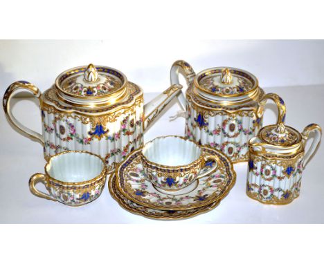 Sevres style tea service, comprising: tea pot and cover, sugar and cover, cream jug and cover, two tea cups and saucers, gilt