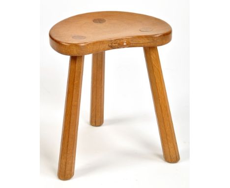 A Robert Thompson of Kilburn (Mouseman) oak kidney-shaped stool, slightly dished seat and carved mouse motif to the edge, rai