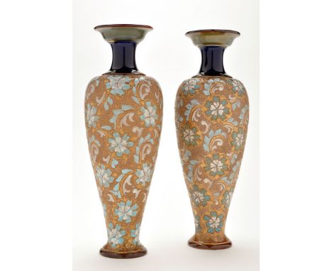 Pair of Royal Doulton stoneware vases, of elongated inverted pair shaped form with turquoise and white enamel flowerheads and
