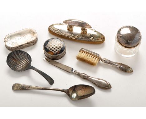 A Georgian caddy spoon with shell bowl (split); a silver snuff box with gilt interior and engraved initials (holed); a white 