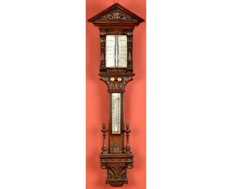 A Victorian carved oak stick barometer, by Dolland, London, with architectural cornice above ivory register flanked by flamin