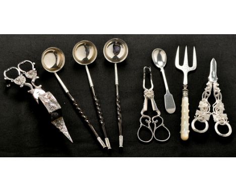 A mixed lot, comprising: three toddy ladles with twisted stained whalebone handles; a pair of grape shears; a toasting fork w