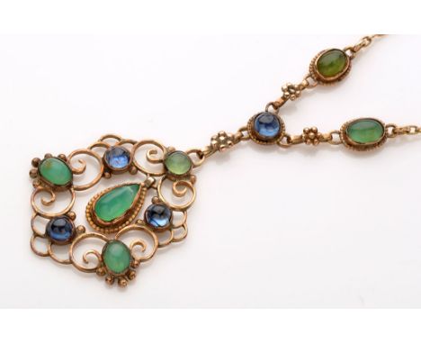 A yellow metal, blue stone and jadeite necklace, the scrolling drop set with three jade cabochons and three blue stone caboch