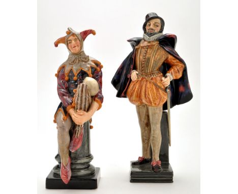 Royal Doulton figure of "Sir. Walter Raleigh", standing wearing an indigo coloured cloak with his left hand holding his sword