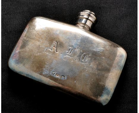 A Victorian silver hip flask, by Edward Smith, Birmingham 1863, rounded rectangular with engraved initials, screw cover, 4.2o