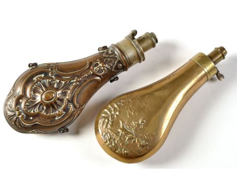 A copper shot flask by G.A.J.W. Hawksley, Sheffield, with steel mount, embossed foliate design, 8 1/2in. (22cms) high; togeth