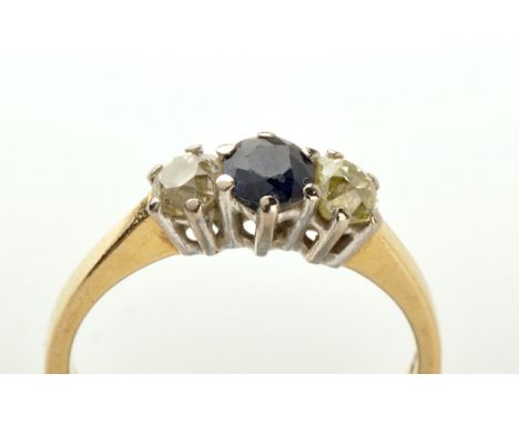 A sapphire and diamond ring, the circular facet cut sapphire set between two old cut diamonds, on yellow metal shank stamped 