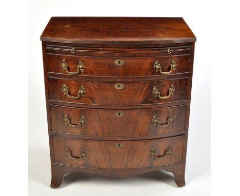 A mahogany bowfront chest of four long graduated drawers fitted moulded brass handles and a brush slide, raised on splay brac