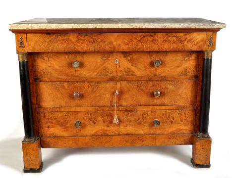 An impressive French Empire walnut chest, with large green fossil marble top above a plain drawer to the frieze, three long g