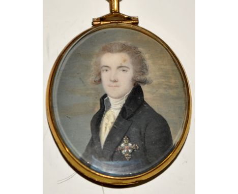 Early 19th Century Continental School
A MINIATURE PORTRAIT OF A YOUNG MAN HALF-LENGTH WEARING A DARK COAT, BLUE SASH AND AN O