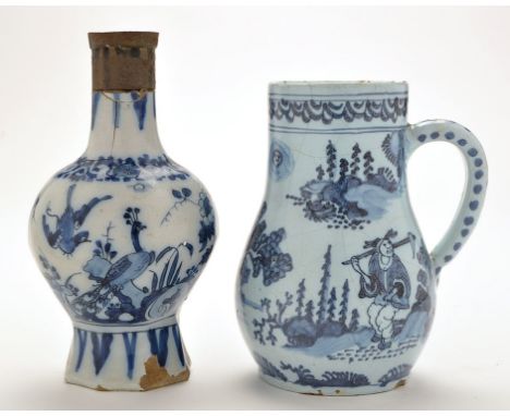 Delftware baluster shaped tankard, painted with chinoiserie figures in landscapes, concentric ring border to rim with blue da