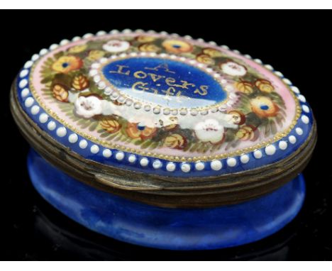 A Georgian enamel patch box, oval, with painted floral decoration "A Lovers Gift", mirror to inside of cover, bears John Jaff
