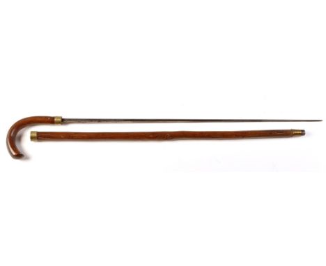 An early 20th Century sword stick, by Mole of Birmingham, the tapering stained wood walking cane with brass collar and taperi