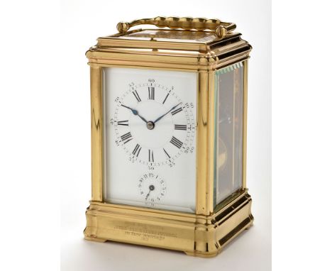 An early 20th Century brass case repeating carriage clock, with alarm, the white enamelled roman dial, alarm dial below, plat