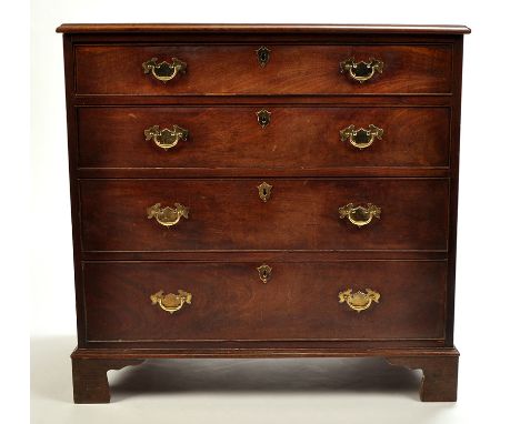 A George III mahogany chest of four long graduated drawers fitted brass handles and escutcheons, raised on bracket feet, 37 x